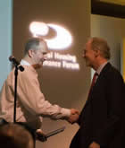 Paul Wenham presenting the award to Housing Solutions